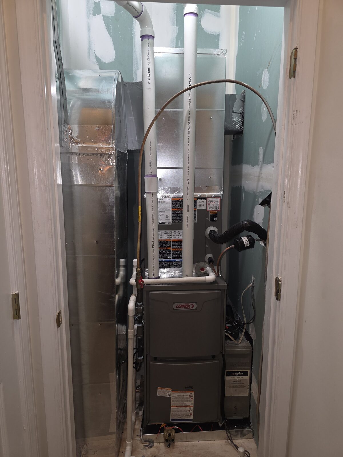 Lennox furnace installation in a home mechanical room